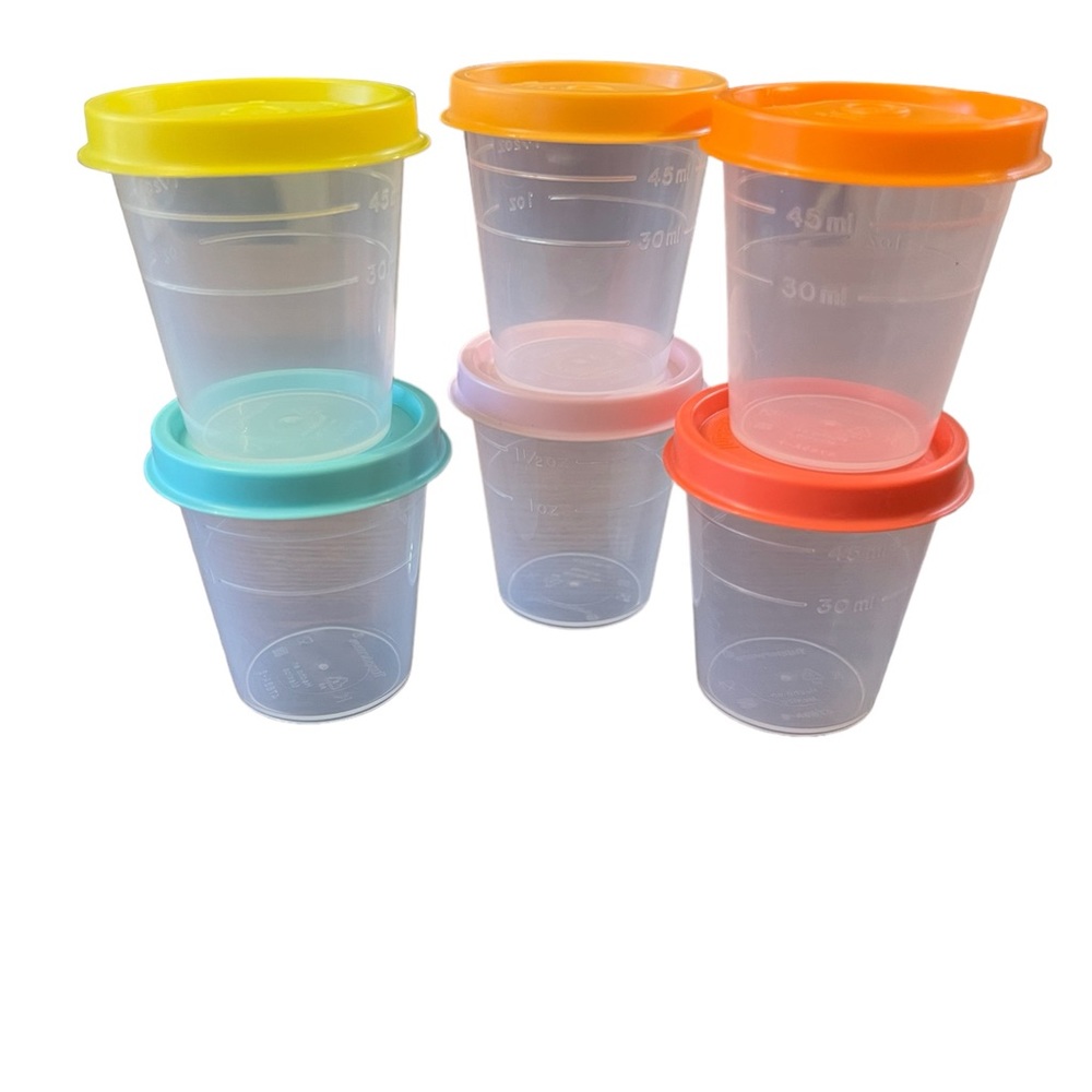 NEW Tupperware six piece minis with seals featuring up to 2 ounces.